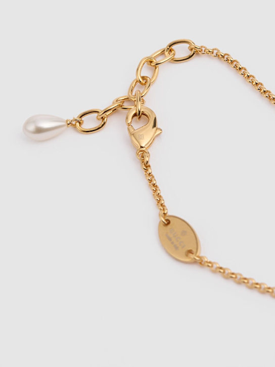 Luisaviaroma Bracciale a catena GG Marmont in ottone con charm Grande vendita